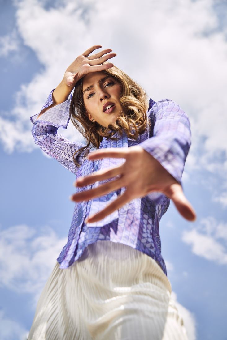 Hand reaching to camera